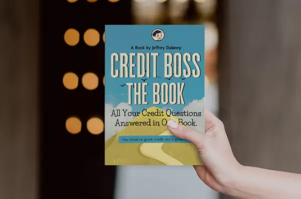 Woman highlighting steps on how to improve credit score from a guide